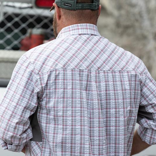 Man wearing grey and white plaid Highridge Seersucker shirt while facing away