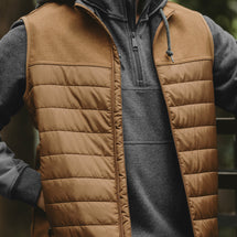 Closeup of man wearing saddle Summit Vest.