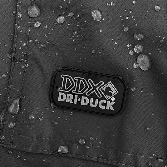 Detail shot of charcoal Field Jacket showing water-resistant DRI DUCK logo