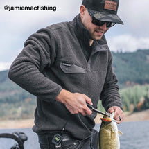 Man wearing charcoal Brooks Fleece Pullover while fishing on lake
