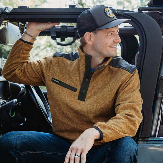 Man wearing saddle Ranger Men's Fleece Pullover while sitting in car.